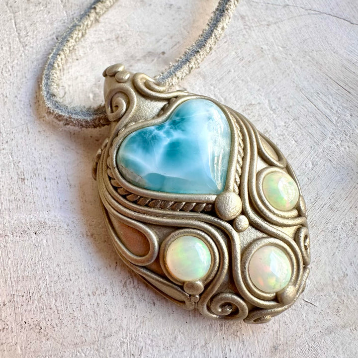 Unique Larimar Heart pendant featuring natural Ethiopian Opal gemstone accents.