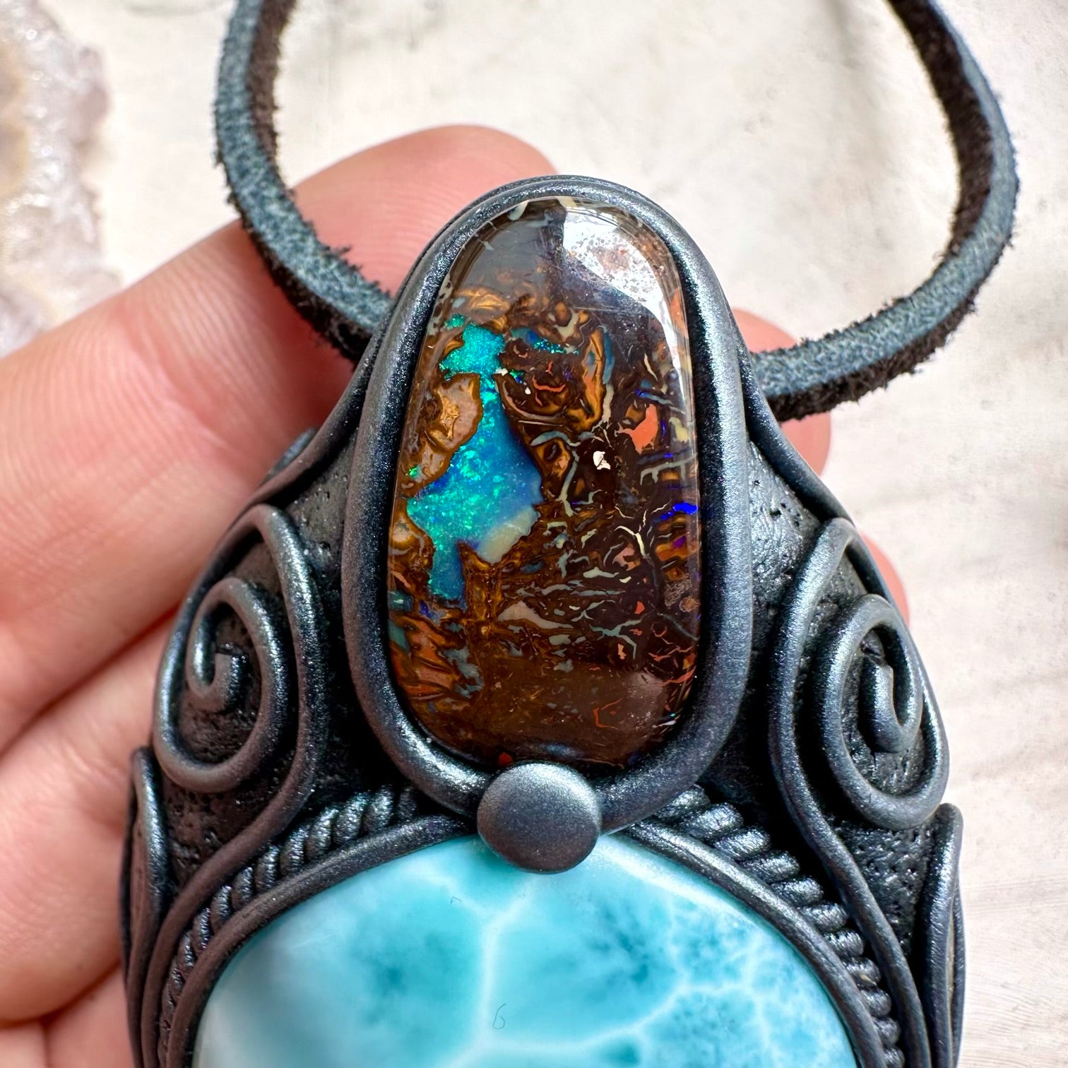 Spiritual jewelry combining larimar and boulder opal