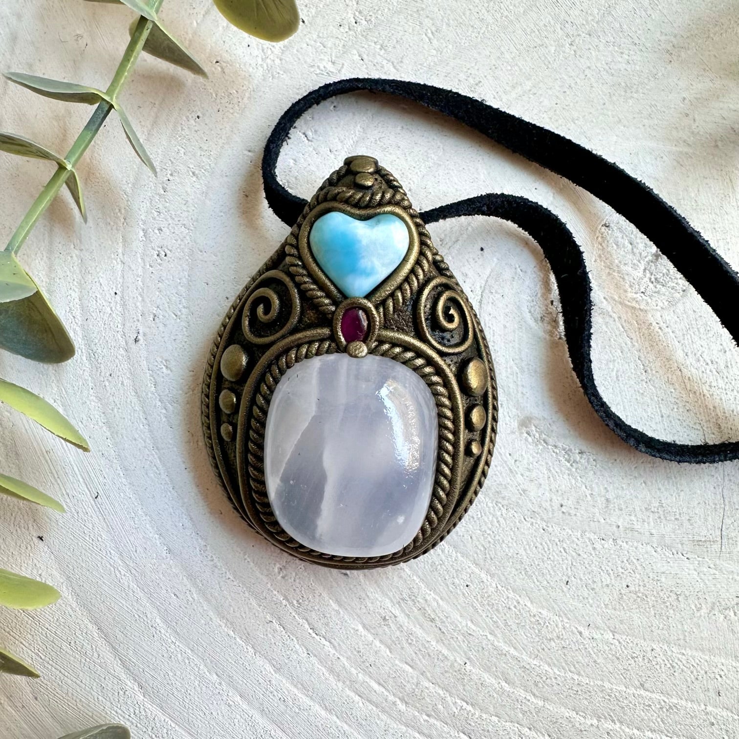 Unique handmade pendant featuring Mango Calcite, Larimar Heart and deep red Rhodolite Garnet.