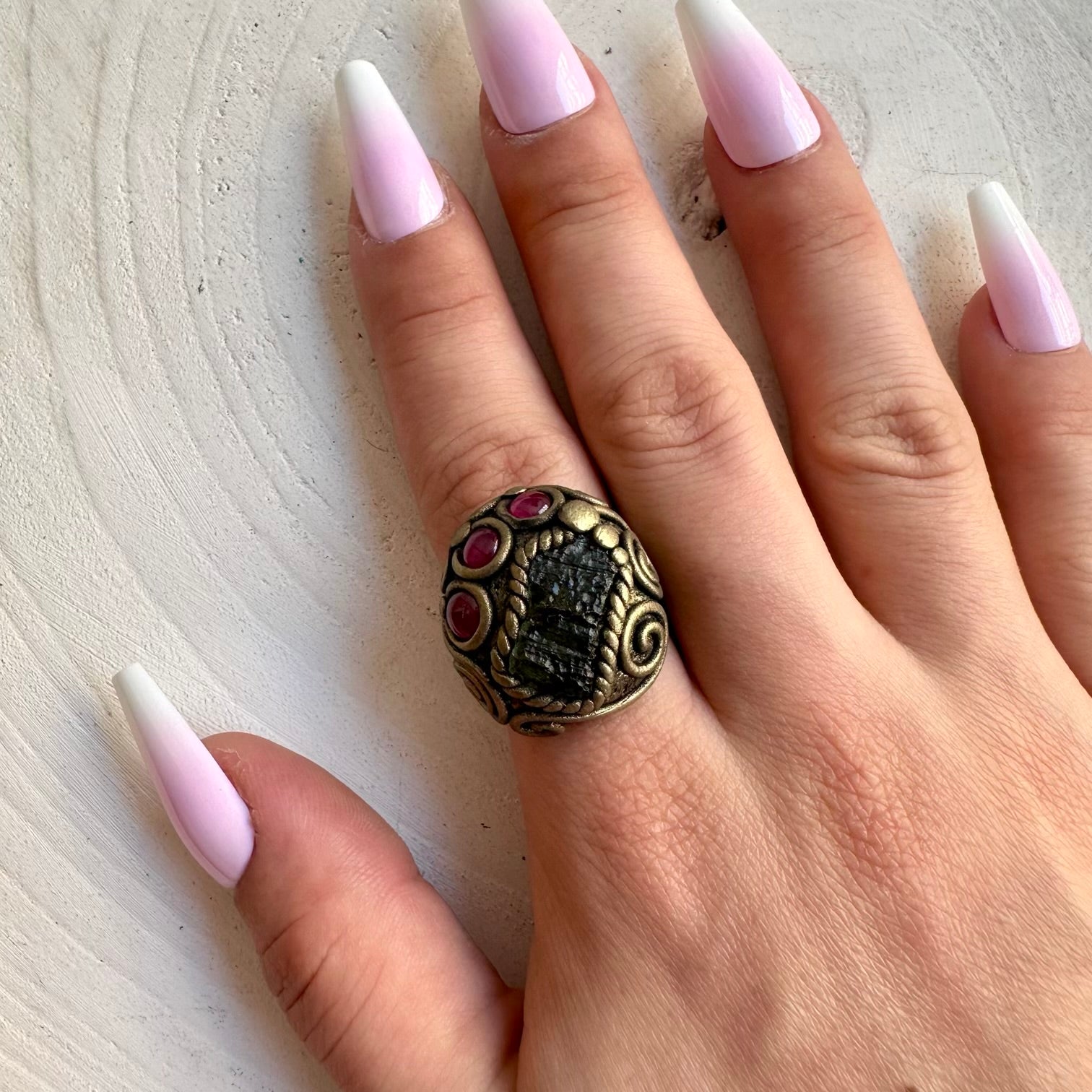 Handmade adjustable ring featuring natural Moldavite and Rhodolite Garnet gemstones.