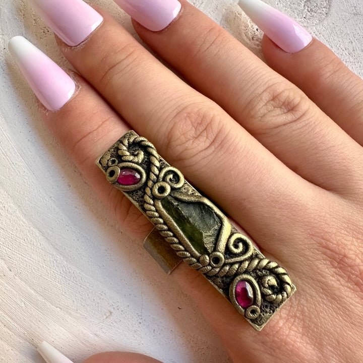 Unique gemstone jewelry with natural Moldavite and vibrant Rhodolite Garnet.