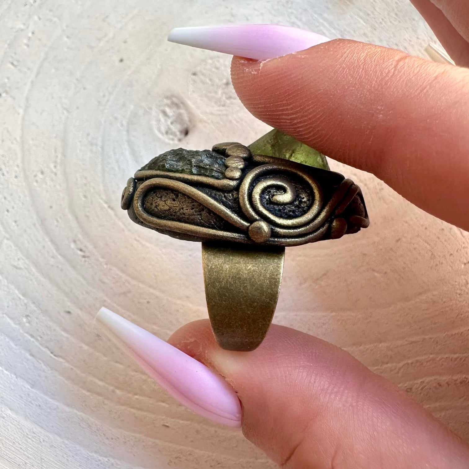 Artisan ring showcasing distinctive green Moldavite with bright Peridot and clear Topaz accents.