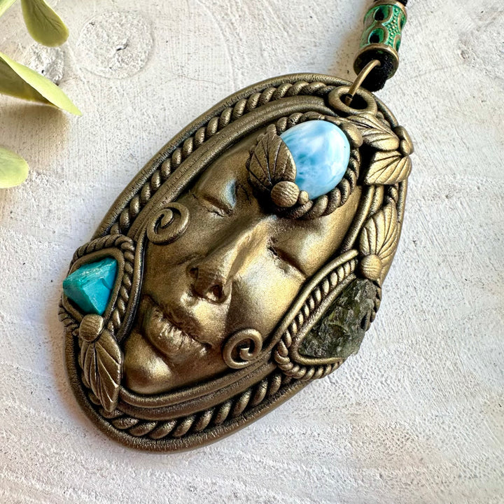 One of a kind Goddess jewelry featuring ocean-blue Larimar and natural green gemstones.