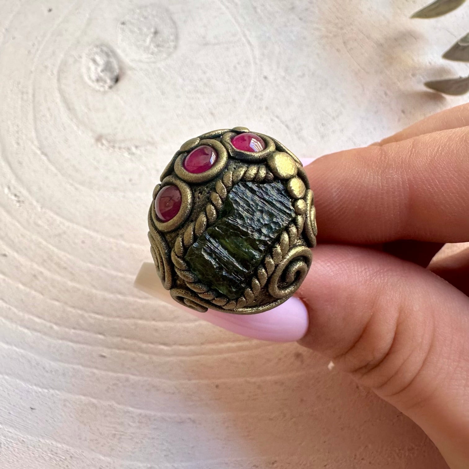 One of a kind handmade ring combining Moldavite with a rich red Garnet gemstone.