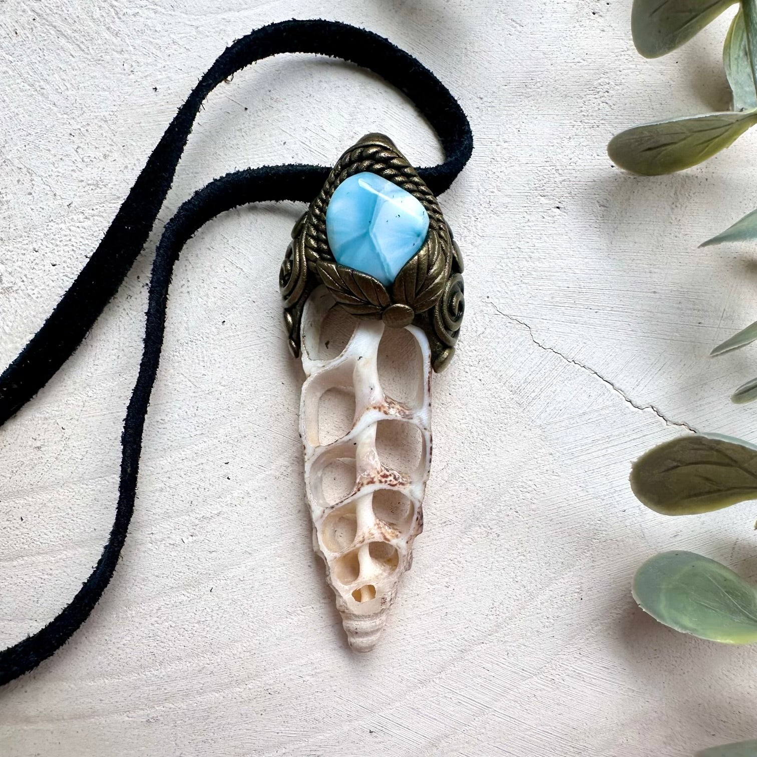 Ocean inspired crystal jewelry featuring Larimar and seashell pendant