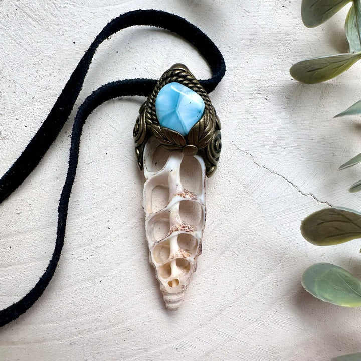 Ocean inspired crystal jewelry featuring Larimar and seashell pendant