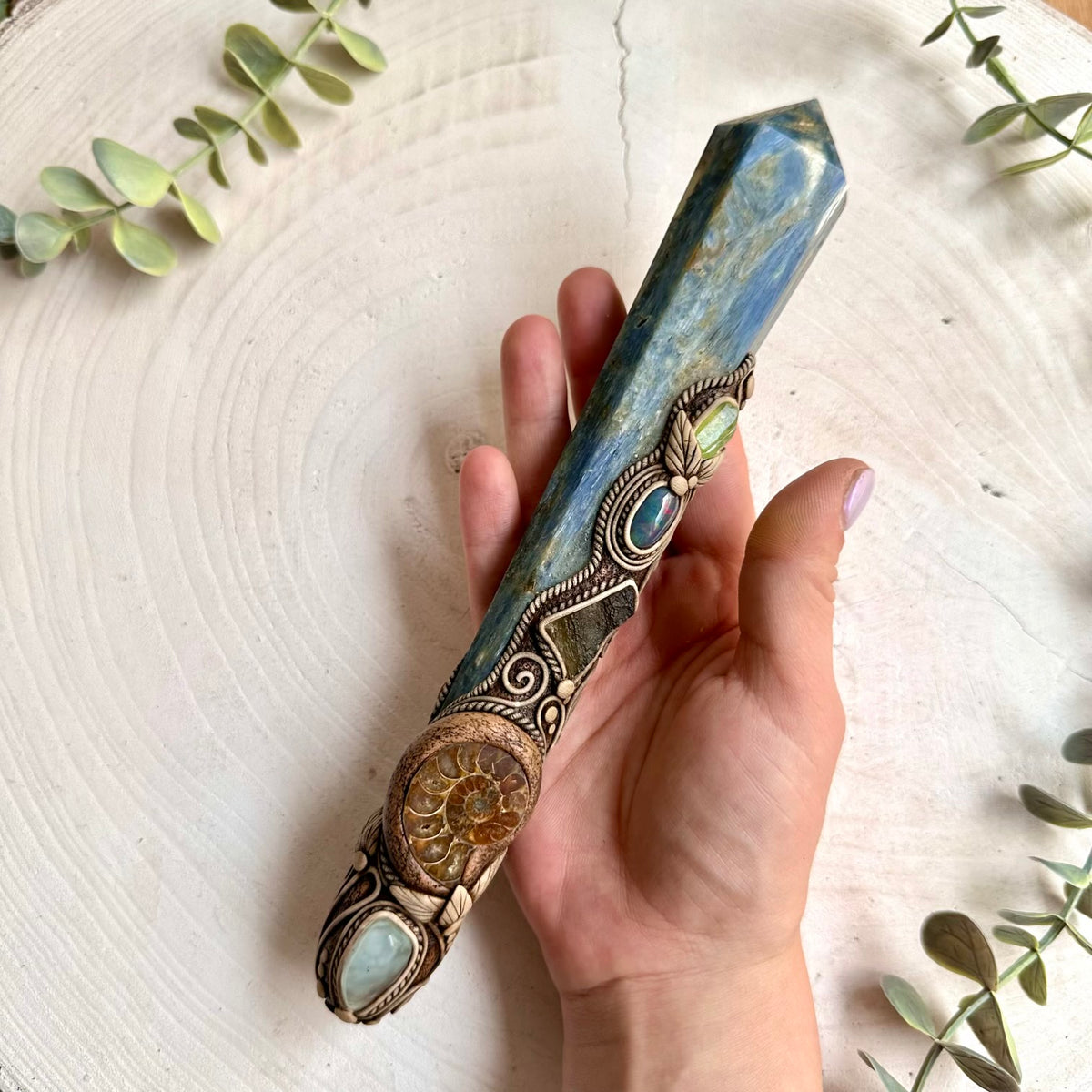 Artisan gemstone wand featuring Blue Kyanite with Black Ethiopian Opal, Peridot and natural Aquamarine accents.