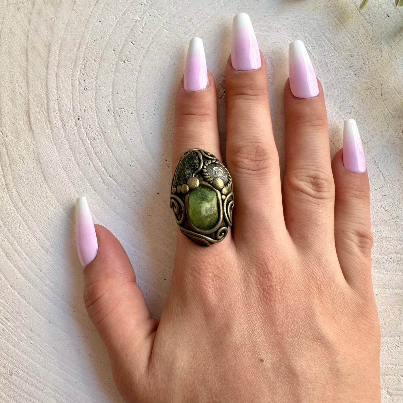 Handmade adjustable ring featuring natural Moldavite, Peridot and Clear Topaz gemstones.