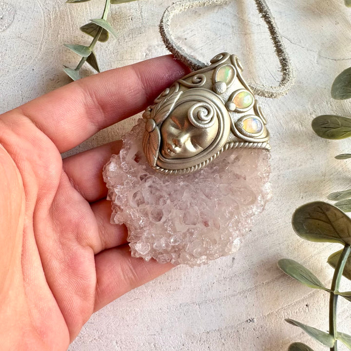 One of a kind crystal Goddess pendant with a natural Quartz Stalactite Slice and colorful Ethiopian Opal.