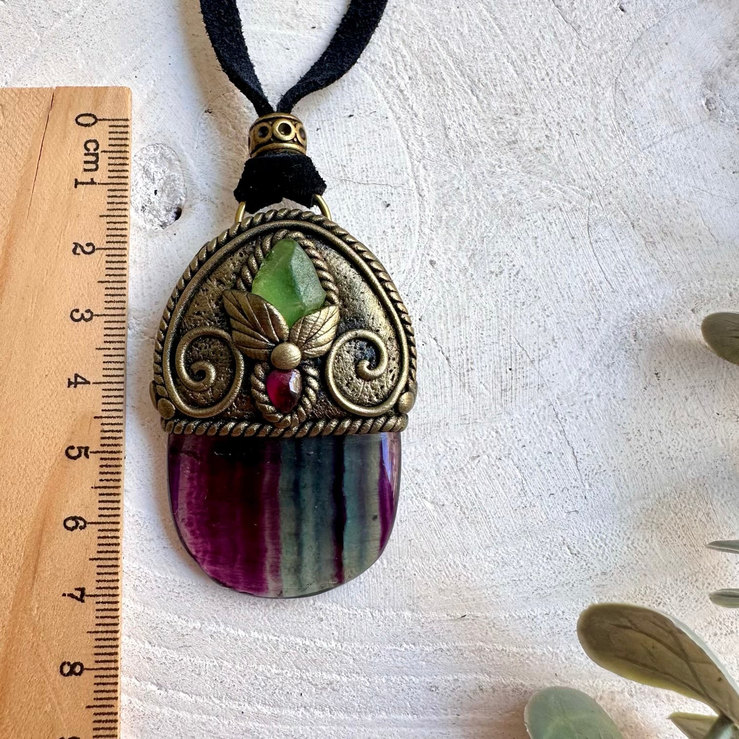 Handmade pendant necklace featuring Rainbow Fluorite, Raw Peridot and Rhodolite Garnet.
