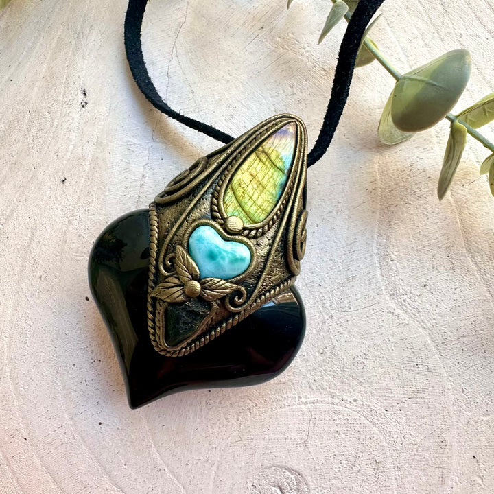 Handmade spiritual necklace featuring Rainbow Obsidian with Larimar and Labradorite.