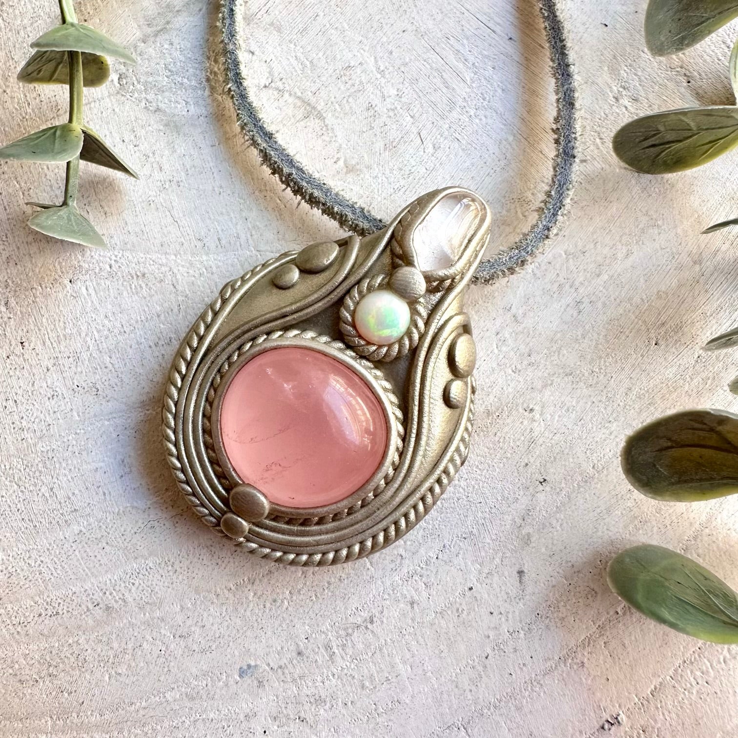 One of a kind handmade necklace combining gentle pink Rose Quartz with luminous white Danburite and colorful Opal.