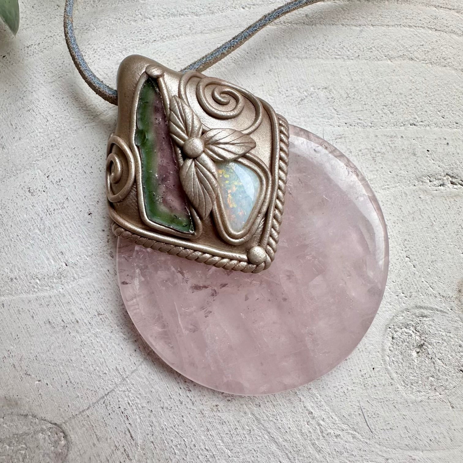 Rose quartz paired with watermelon tourmaline slice and opal in a necklace