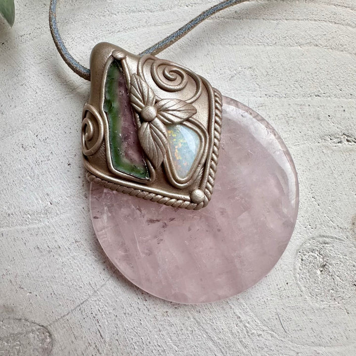 Rose quartz paired with watermelon tourmaline slice and opal in a necklace