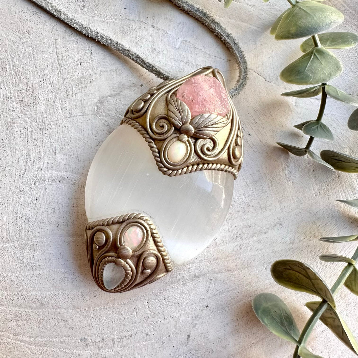 Handmade Selenite with Raw Morganite, Clear Topaz and Ethiopian Opal healing crystal talisman / pendant necklace, a one of a kind spiritual jewelry piece combining luminous Selenite with delicate Raw Morganite, sparkling Clear Topaz and colorful Ethiopian Opal.