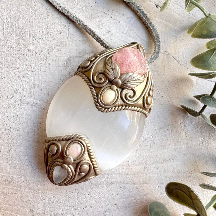 Unique spiritual pendant featuring Selenite, Raw Morganite, Clear Topaz and colorful Ethiopian Opal.