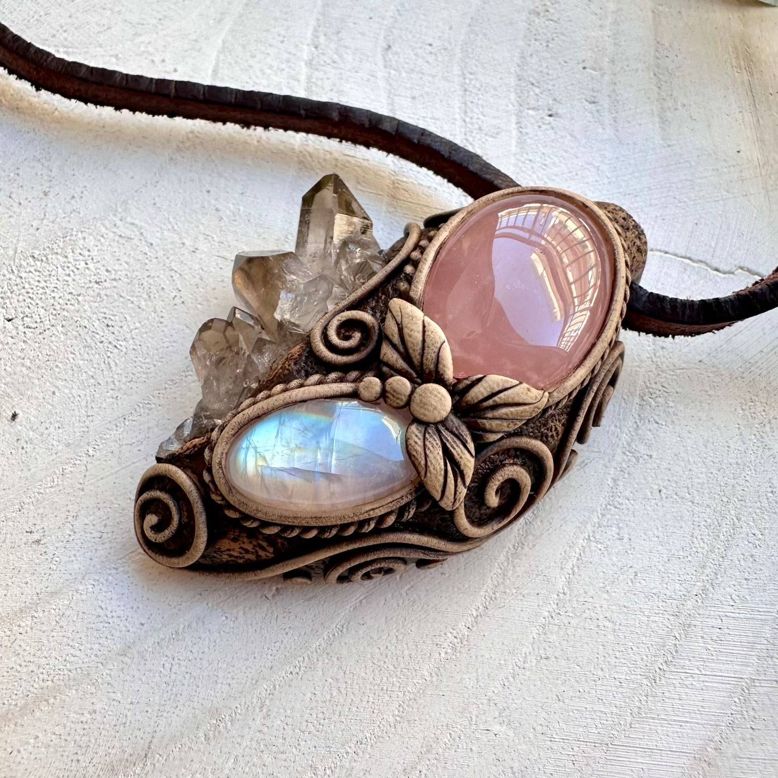 Spiritual pendant featuring smoky quartz cluster and moonstone