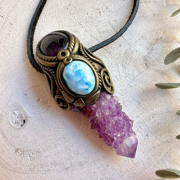 Natural Spirit Quartz pendant featuring a Larimar gemstone and rich purple Amethyst detail.