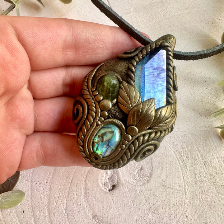 One of a kind crystal necklace handcrafted with Aqua Aura Quartz and colorful natural accents.