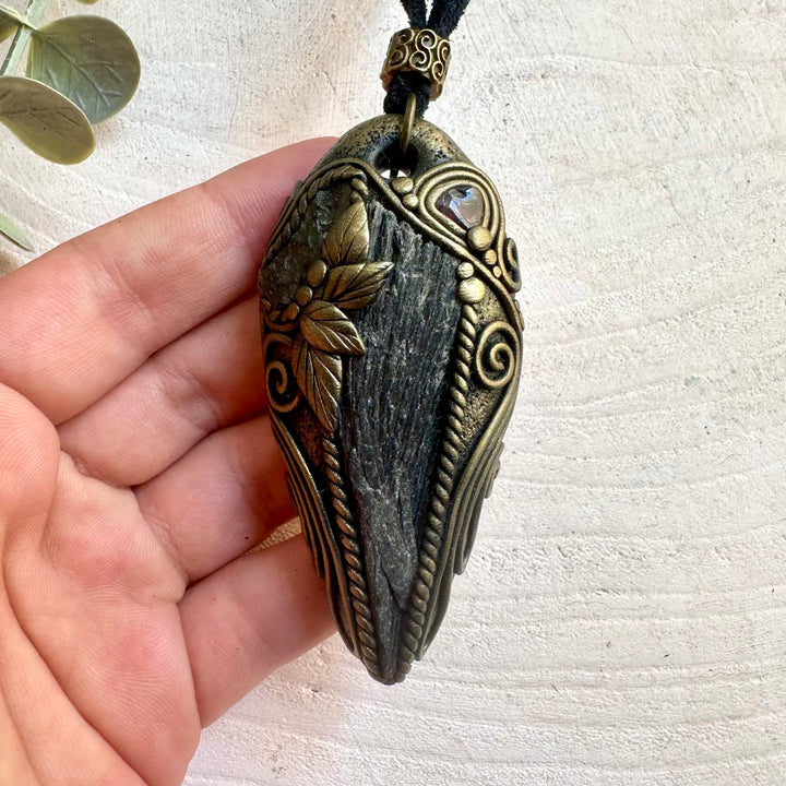 Black Kyanite pendant necklace handcrafted with Moldavite and Red Garnet natural gemstones.