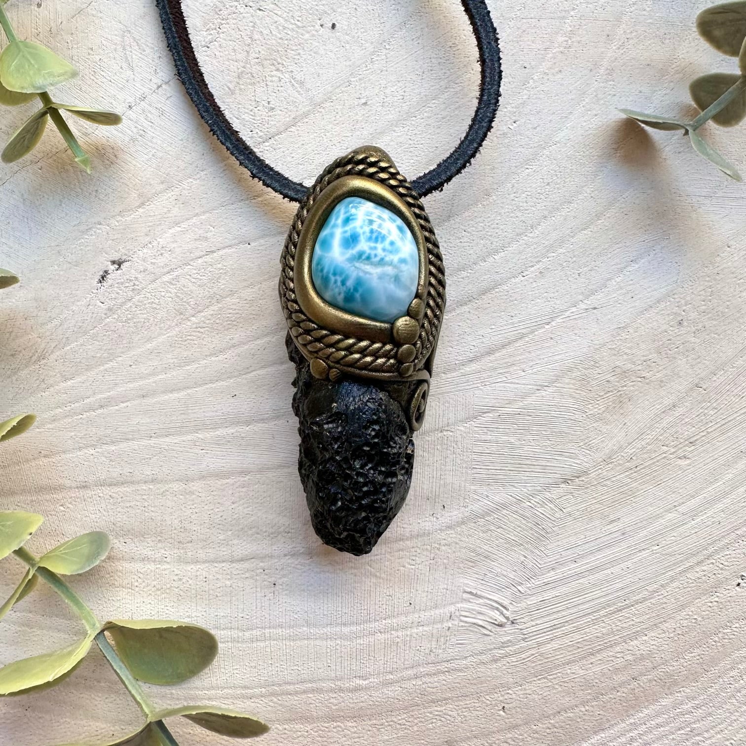 Black tektite paired with larimar in a necklace