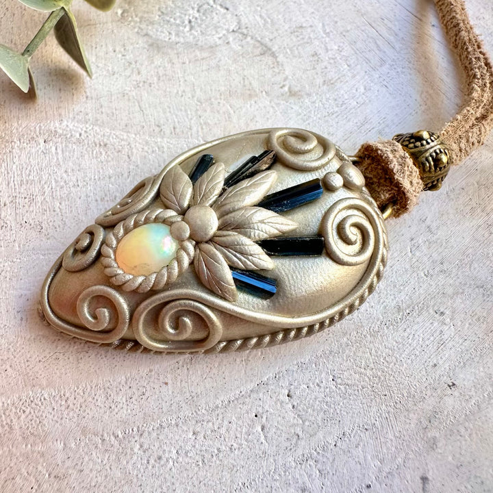 One of a kind handmade jewelry combining deep blue Tourmaline with colorful Opal.