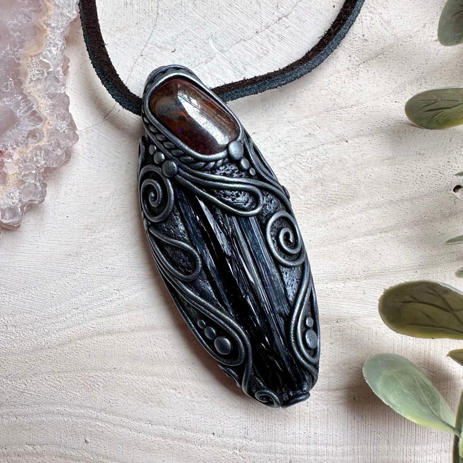 Natural vivianite paired with boulder opal in a necklace
