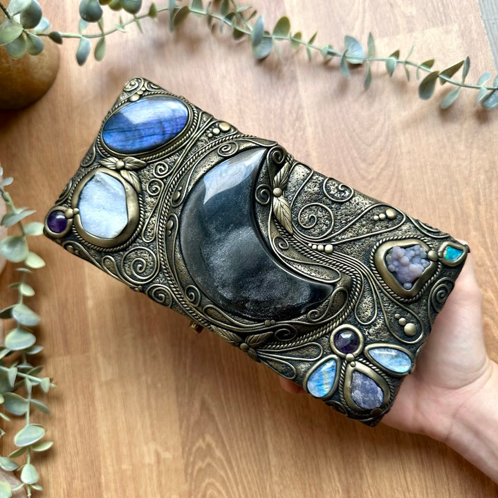 Handmade wooden box decorated with crystals, featuring a silver sheen obsidian moon centerpiece
