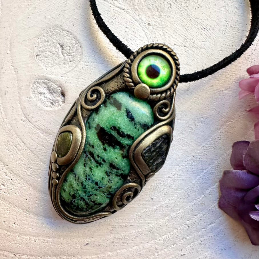 Ethically sourced Zoisite crystal paired with genuine Moldavite and calming Green Tourmaline eye amulet, handcrafted healing spiritual necklace.