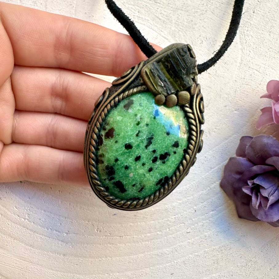 Ethically sourced raw Moldavite and natural Zoisite pendant, handcrafted metaphysical healing crystal jewelry.
