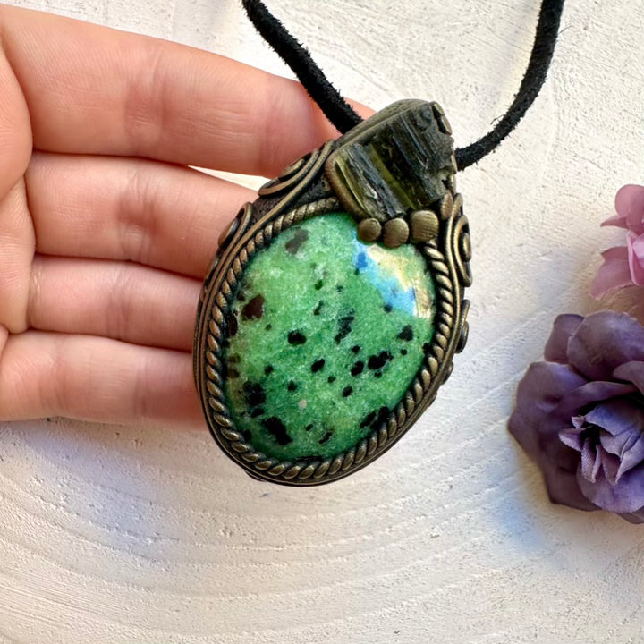 Ethically sourced raw Moldavite and natural Zoisite pendant, handcrafted metaphysical healing crystal jewelry.