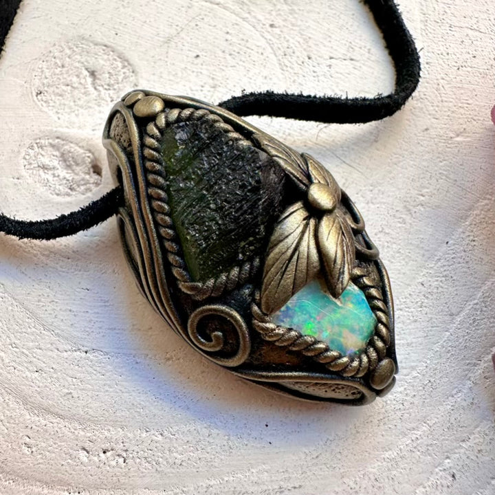 Spiritual protection crystal amulet necklace featuring raw green Moldavite and Ethiopian Opal fire flash pendant, handmade with love.