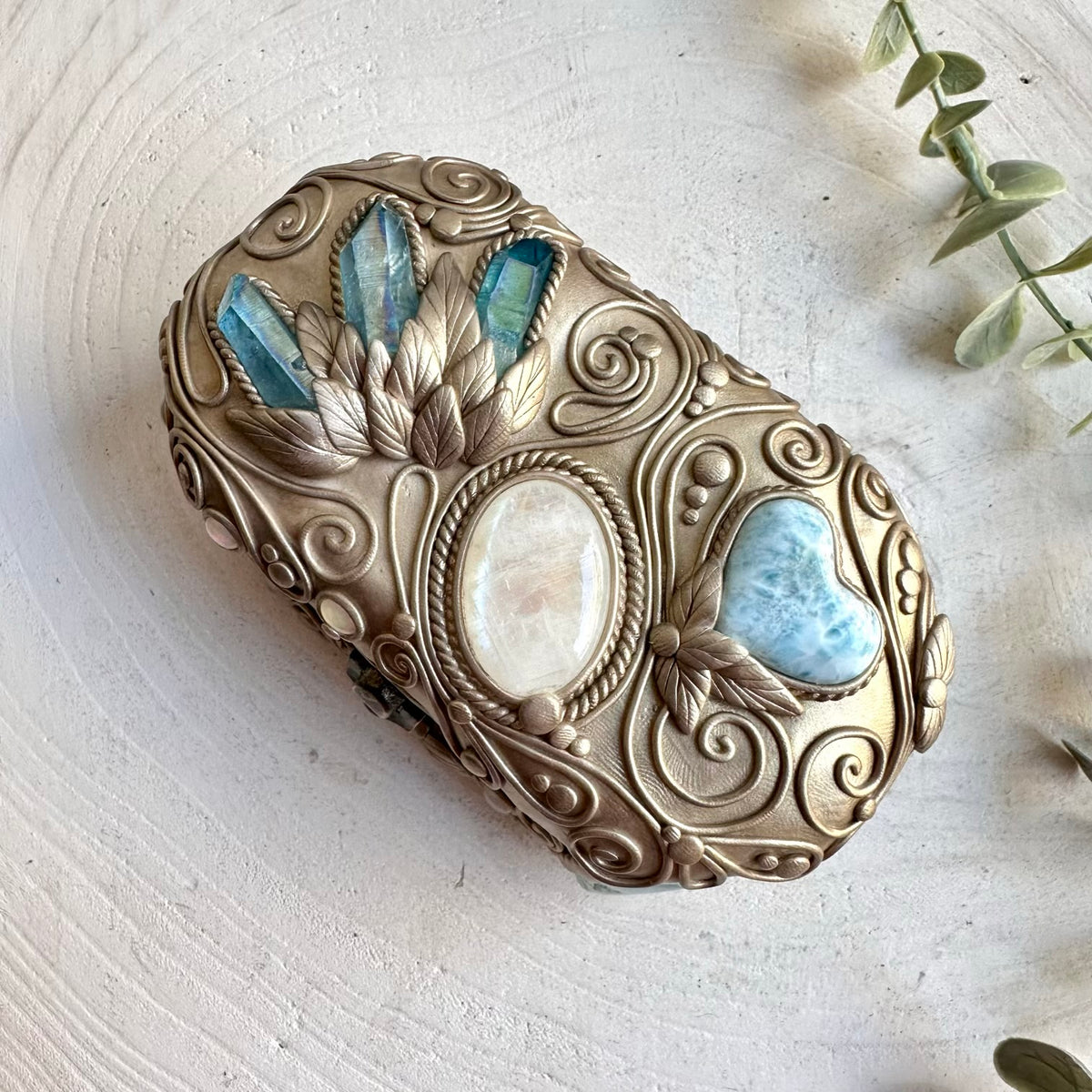Artisan crystal home decor featuring Aqua Aura Quartz, Aquamarine, Larimar, Moonstone and Ethiopian Opal.