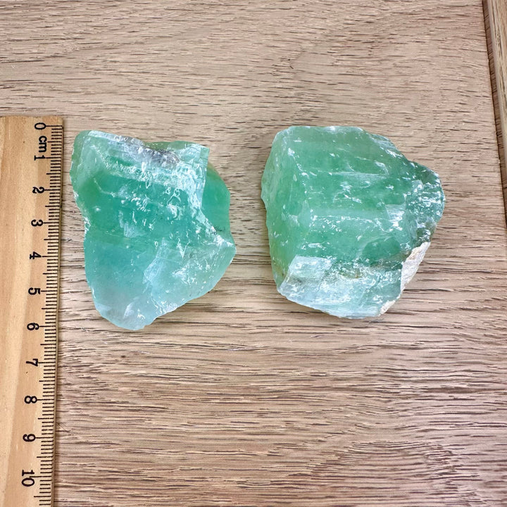 Raw green calcite healing stone with natural patterns