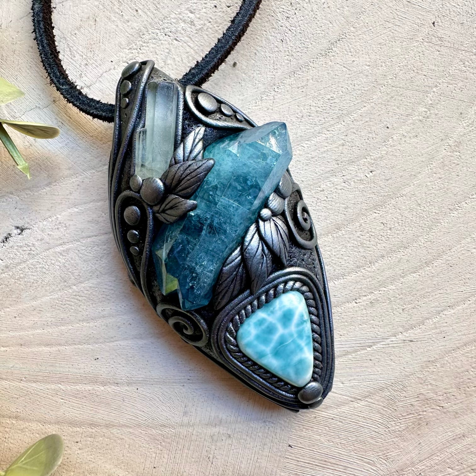 Aura quartz paired with aquamarine and larimar in a necklace