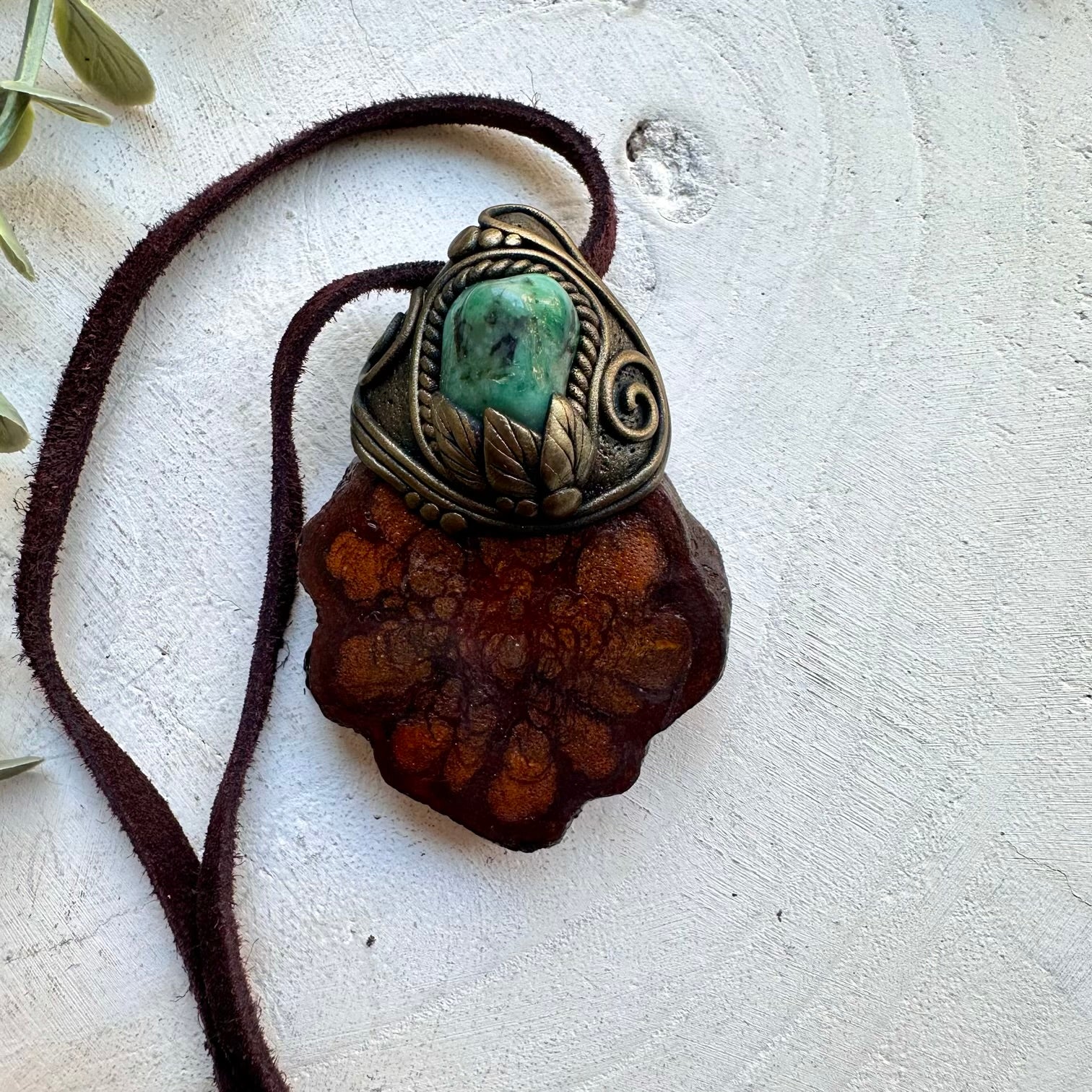 Handmade shamanic amulet necklace with emerald gemstone and bi caapi vine