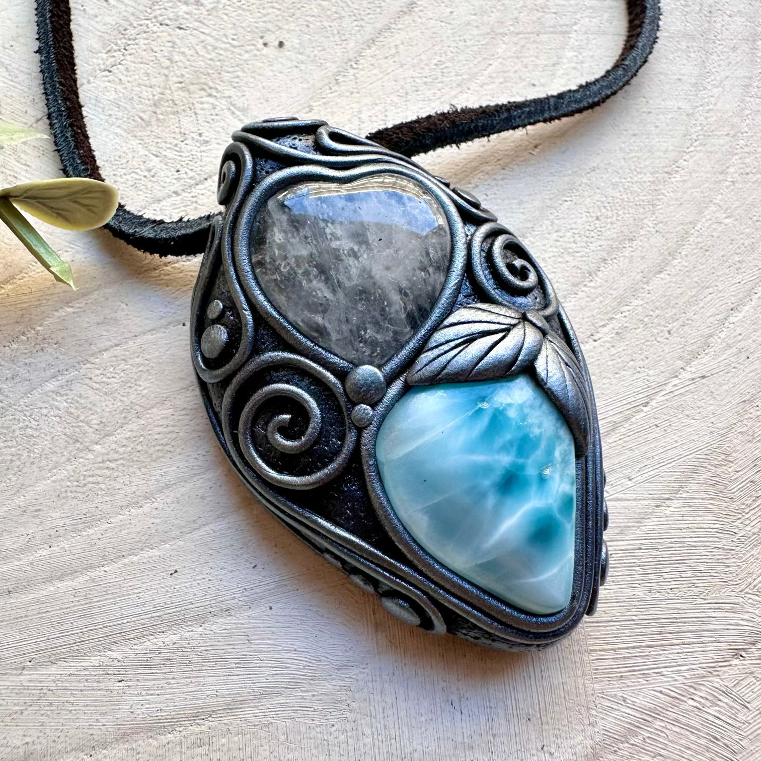 Larimar paired with clear quartz heart in a necklace