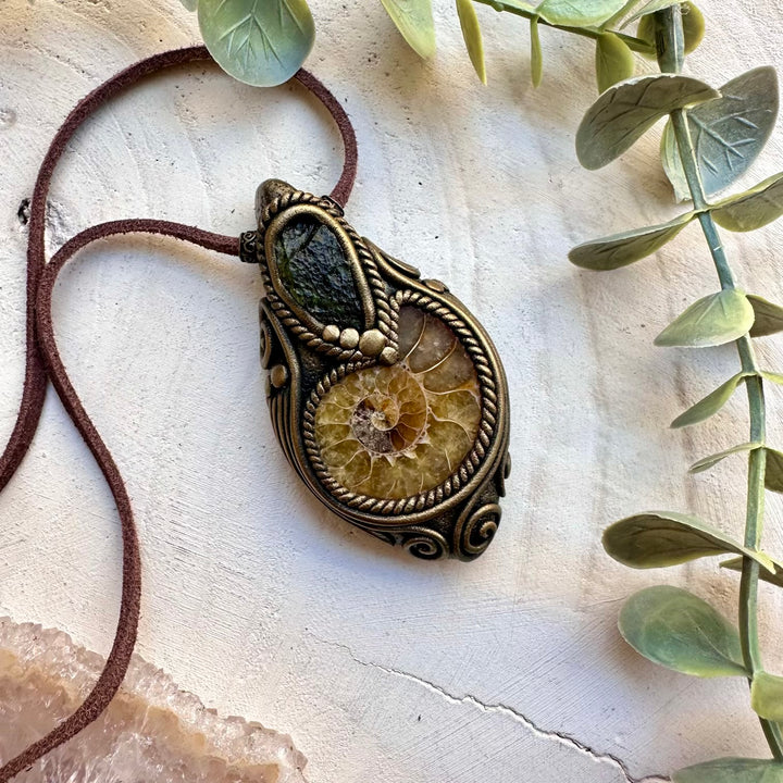 Natural ammonite paired with genuine moldavite in a necklace