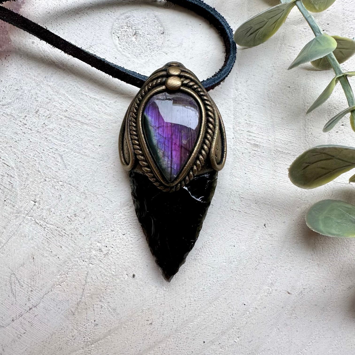 Spiritual jewelry combining obsidian arrowhead and labradorite