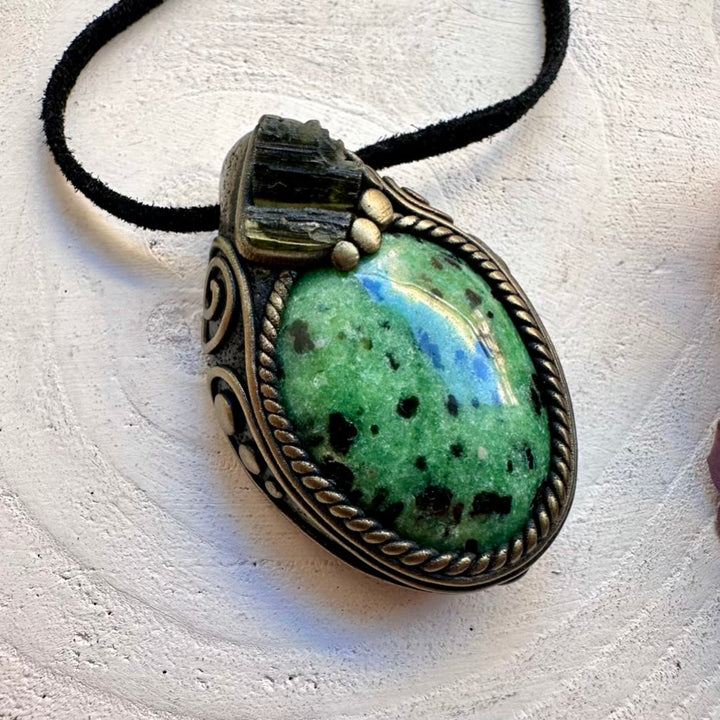 Unisex metaphysical healing crystal necklace featuring natural imperfect Zoisite gemstone and raw green Moldavite pendant.