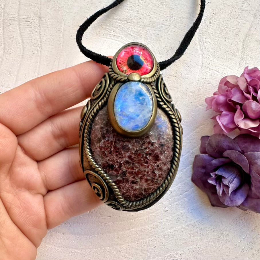 Unisex spiritual eye amulet necklace featuring ethically sourced Red Garnet and calming Rainbow Moonstone energy.