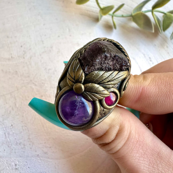 Scapolite paired with rhodolite garnet and amethyst in a ring