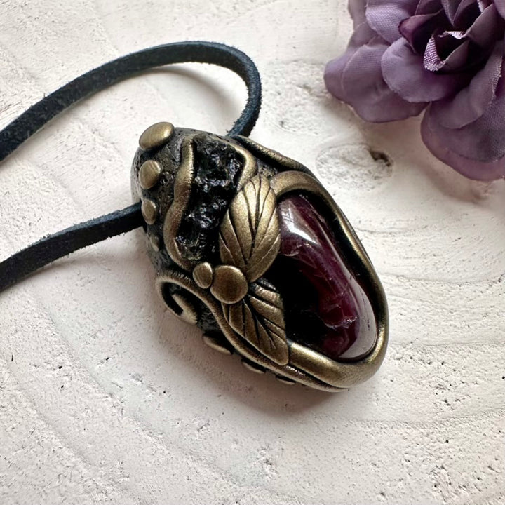 Protective Moldavite crystal and heart-strengthening Red Garnet pendant, handmade spiritual talisman jewelry.