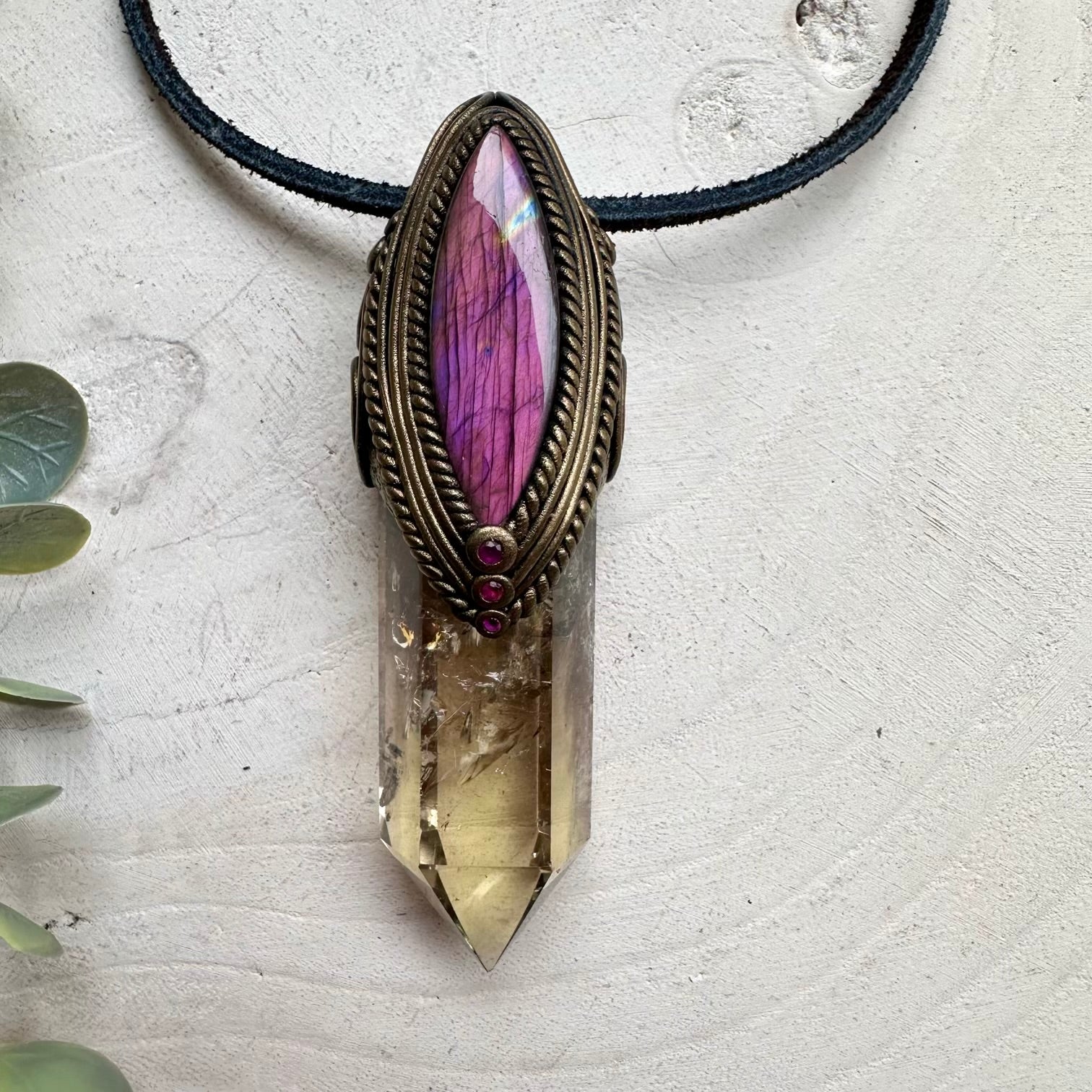 Citrine crystal paired with ruby and labradorite in a necklace