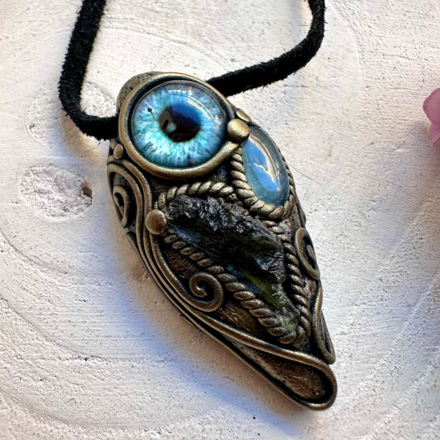 Handmade energy tool necklace featuring Moldavite crystal and a soothing blue Aquamarine protective eye pendant.