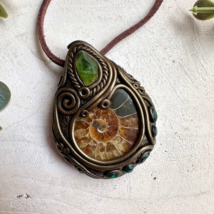 Healing gemstone jewelry necklace with ammonite, peridot, and black Ethiopian opal