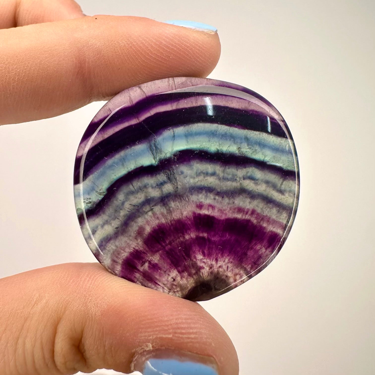 Polished fluorite flat stone used for study and concentration