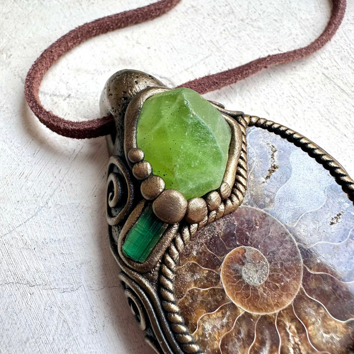 Healing stone necklace with ammonite fossil, green tourmaline, and peridot gemstones