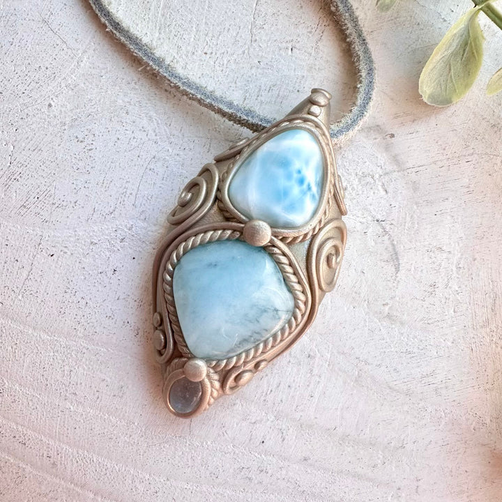 Protection amulet crystal necklace with aquamarine, larimar, and clear topaz gemstones