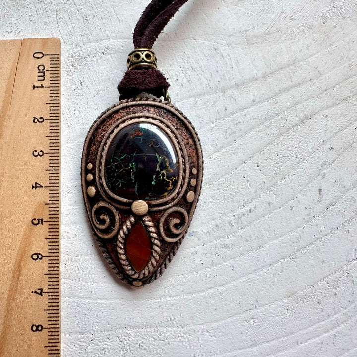 Handmade crystal necklace with Boulder Opal and Ammolite for collectors and gemstone lovers.